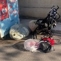 Gravina, basta raccoglitori di indumenti per strada.